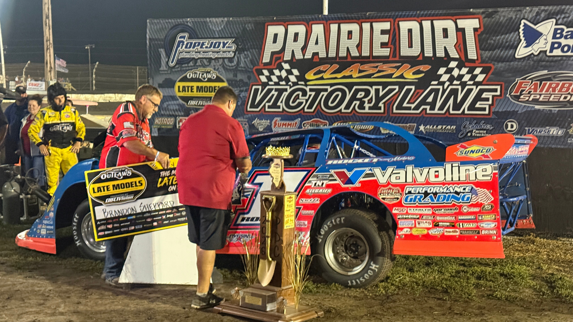 Brandon Sheppard and the Rocket Chassis house car celebrating a Prairie Dirt Classic victory